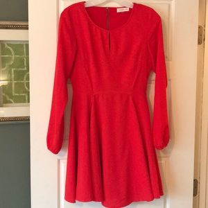 Red, long-sleeved dress perfect for Valentine’s